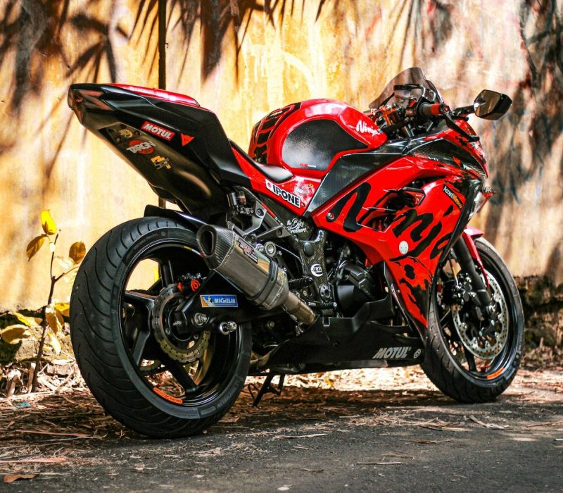 red and black sports bike
